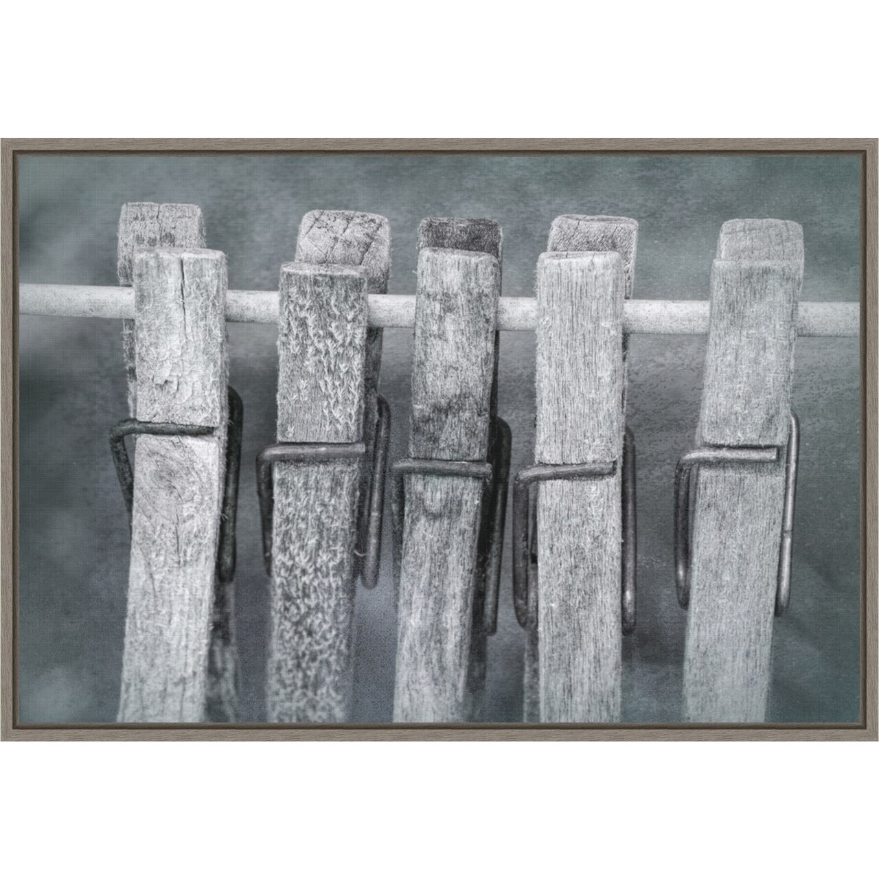 Black and white of clothespins hanging from clothes line by Jaynes Gallery Danita Delimont 23-in. W x 16-in. H. Canvas Wall Art Print Framed in Grey
